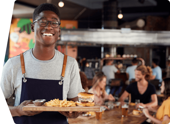 A waiter holding a tray of food